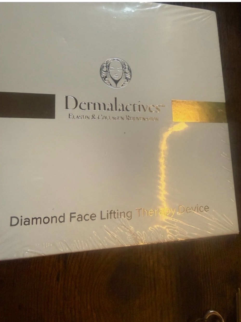 Dermalactives Diamond Face Lifting Therapy Device in White with Gold Accents